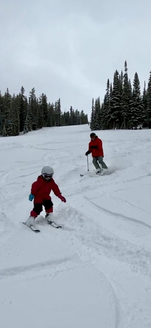 Grandpa following Darwin through fresh snow
